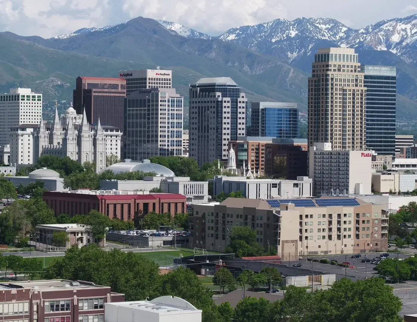 Clear skyline view of Salt Lake City, Utah with the Wasatch Mountains behind downtown buildings