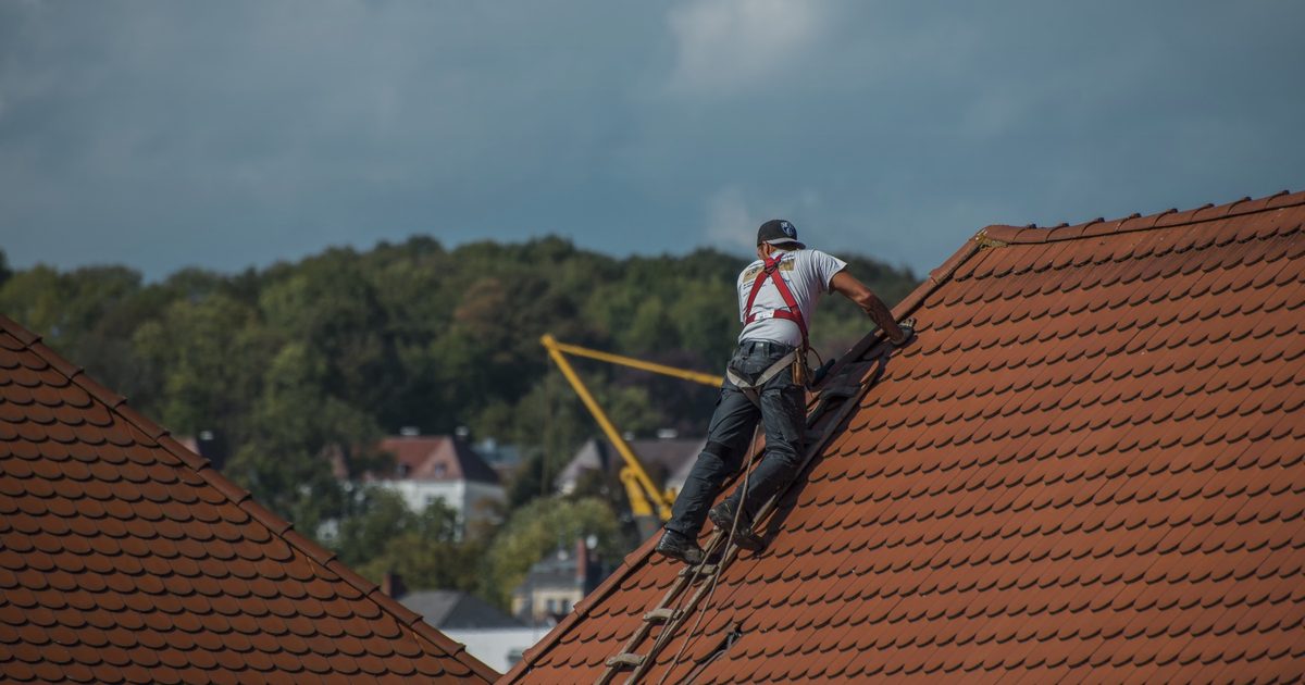 Roofer website design example with a premium residential roof hero image